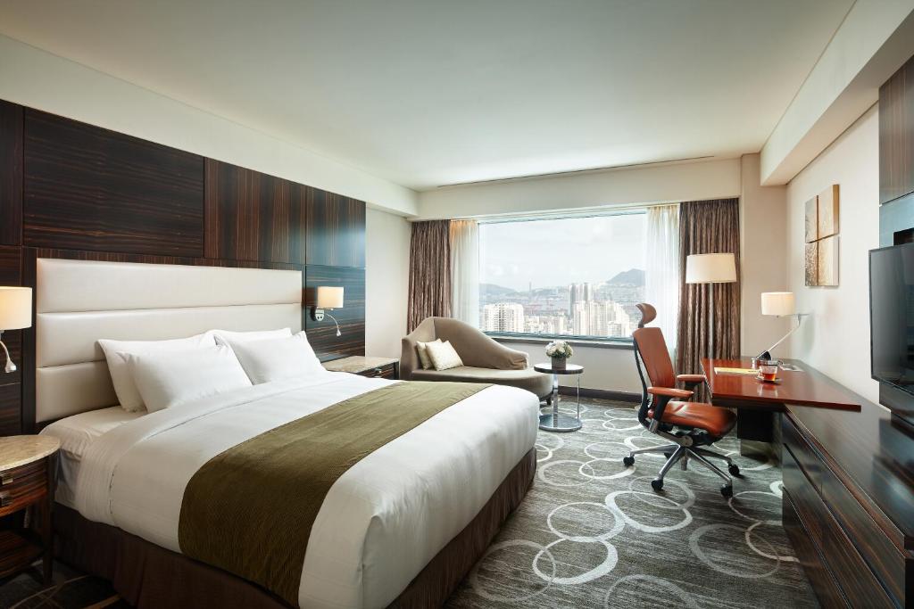 Postel nebo postele na pokoji v ubytování Lotte Hotel Busan