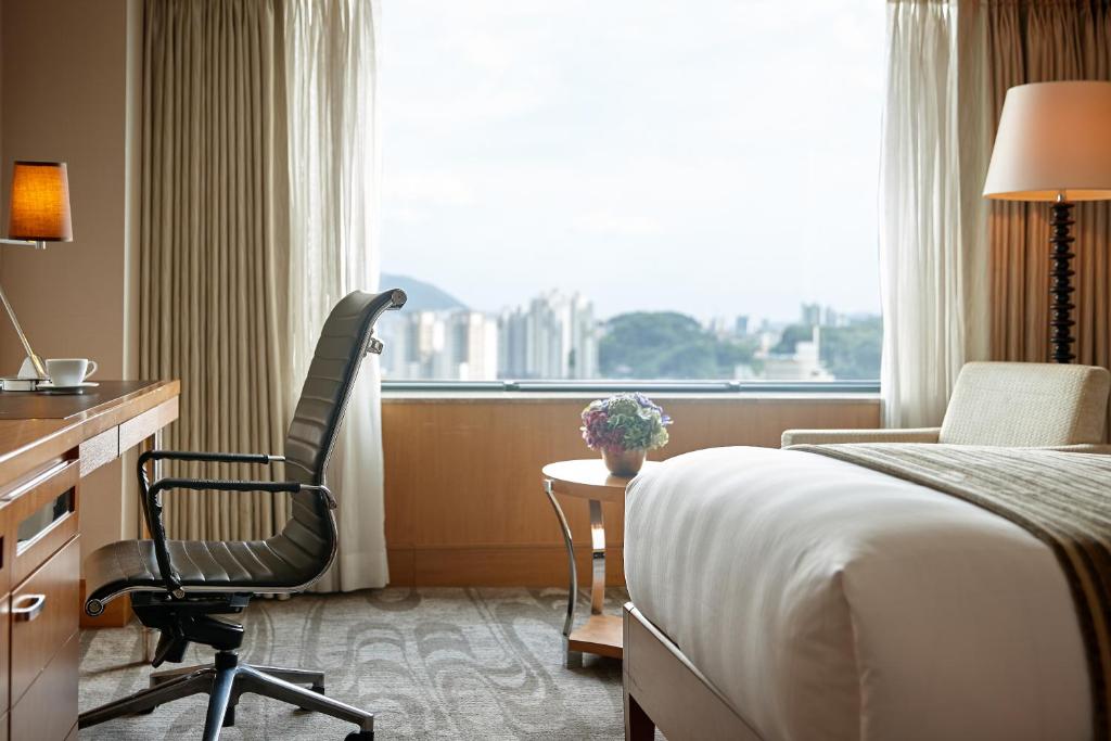 Postel nebo postele na pokoji v ubytování Lotte Hotel Busan