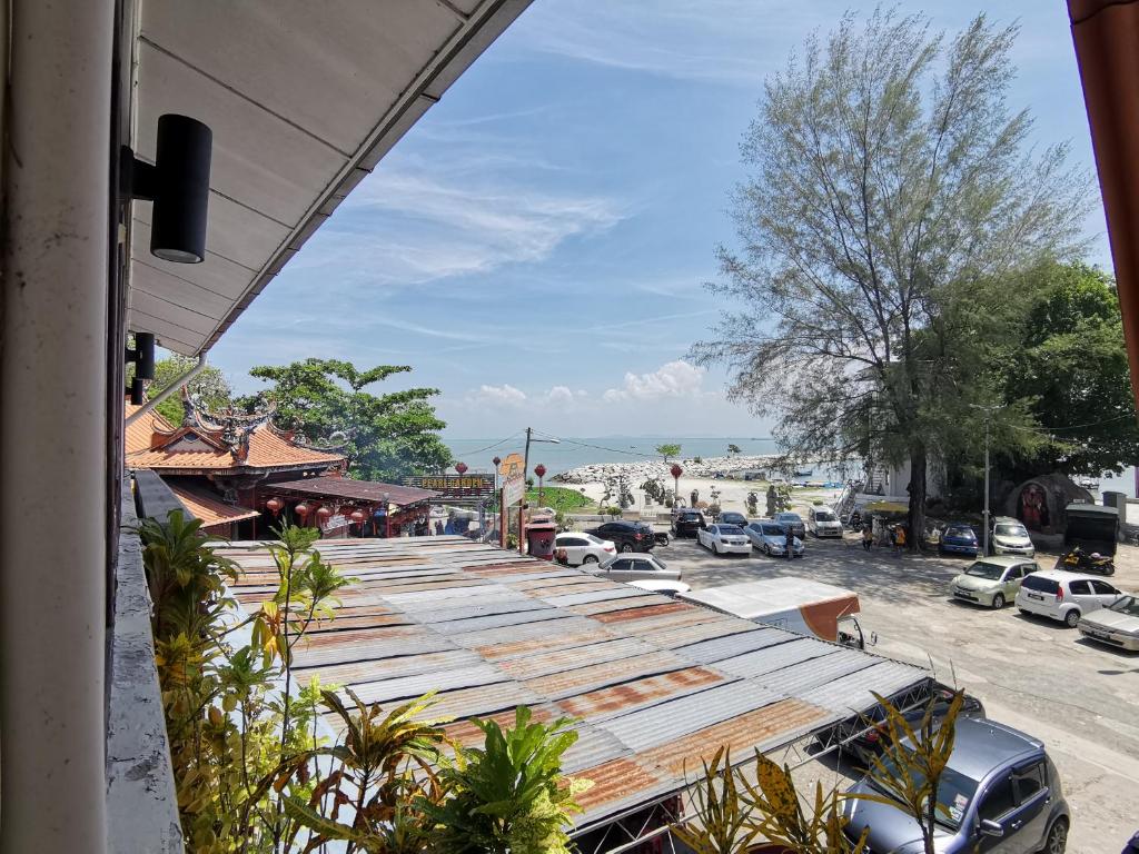 a street with cars parked in a parking lot at 8 Boutique By The Sea in George Town