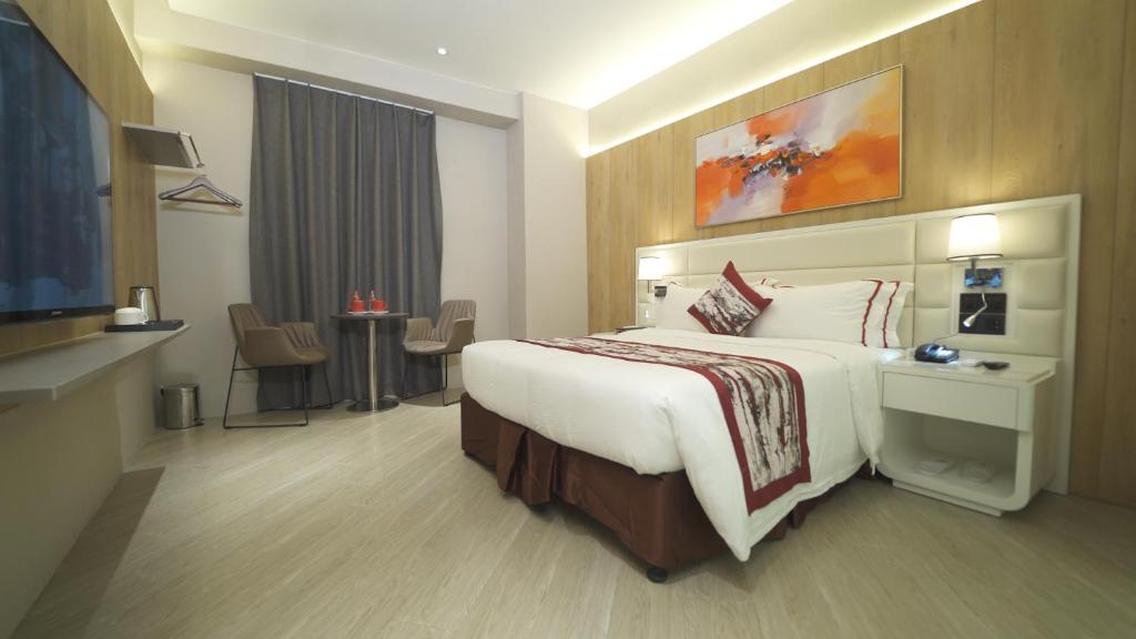 Postel nebo postele na pokoji v ubytování Red Hotel Cubao, Quezon City