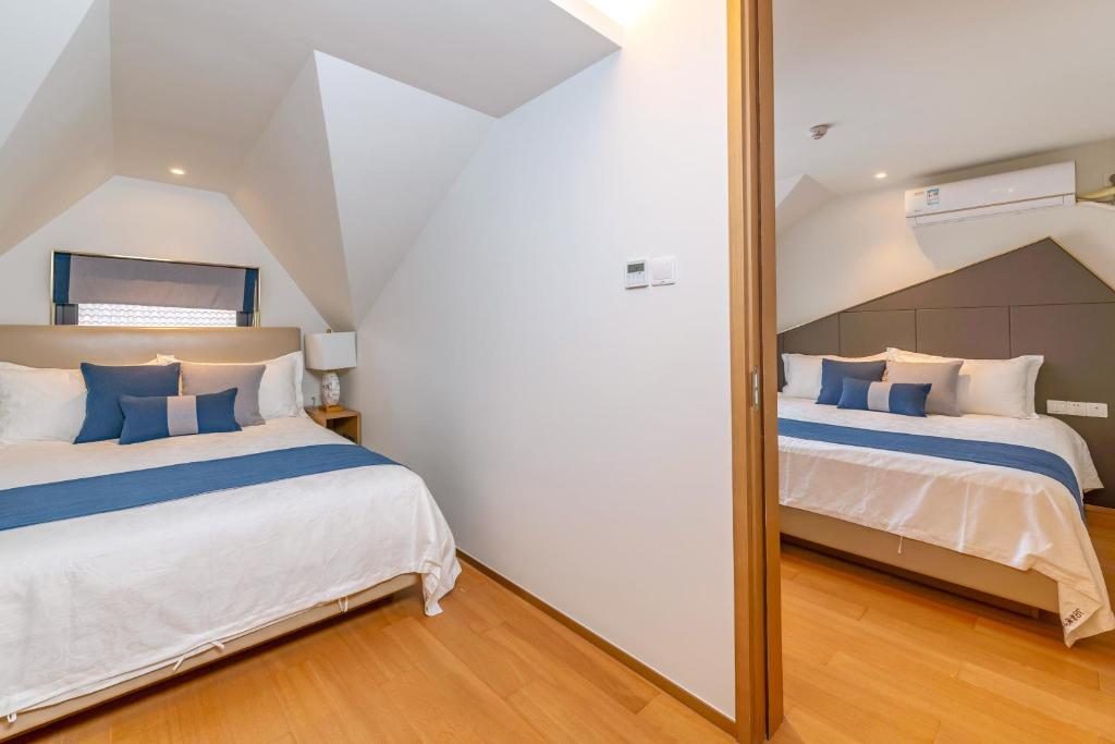 Postel nebo postele na pokoji v ubytování Hangzhou Ziwei Boutique Homestay