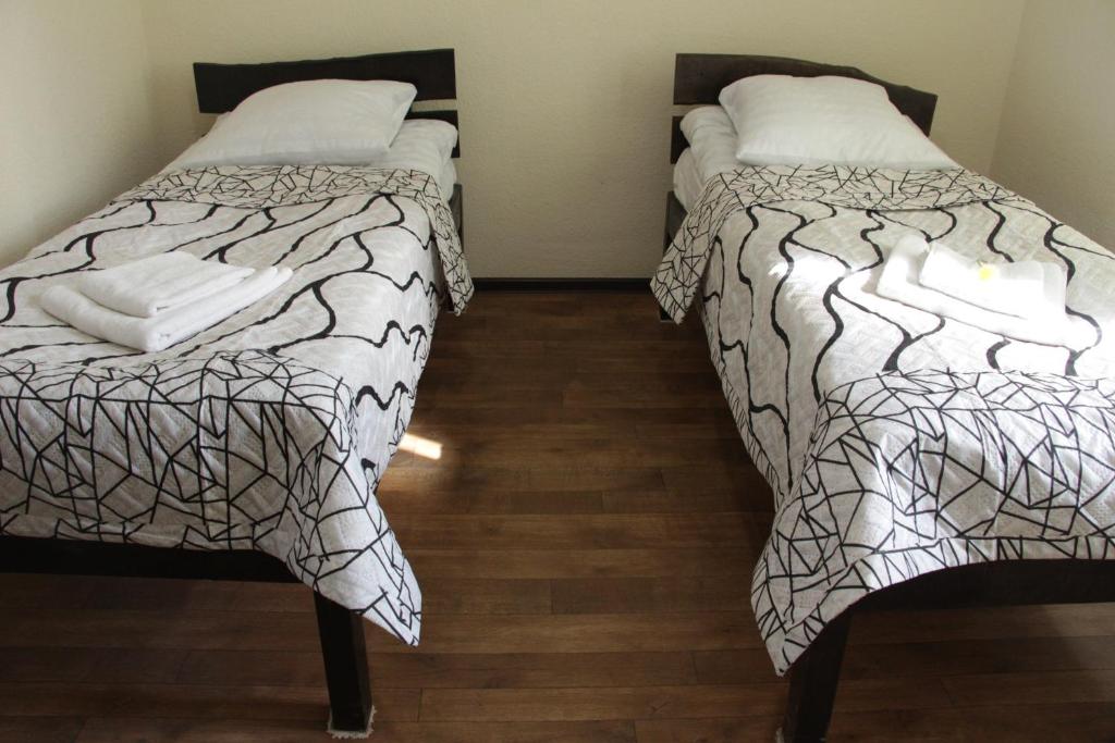 Postel nebo postele na pokoji v ubytování Snow Leopard Hostel