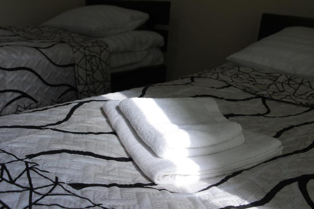 Postel nebo postele na pokoji v ubytování Snow Leopard Hostel