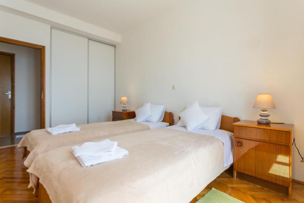 Postel nebo postele na pokoji v ubytování Apartment Sea to Sky Dubrovnik