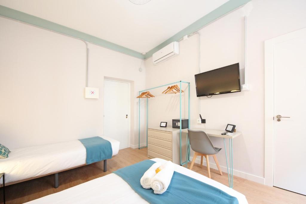 Televízia a/alebo spoločenská miestnosť v ubytovaní Regina Selfcheck-in Smart Rooms