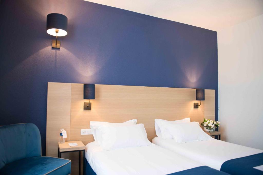 Postel nebo postele na pokoji v ubytování Best Western Hôtel Le Sud