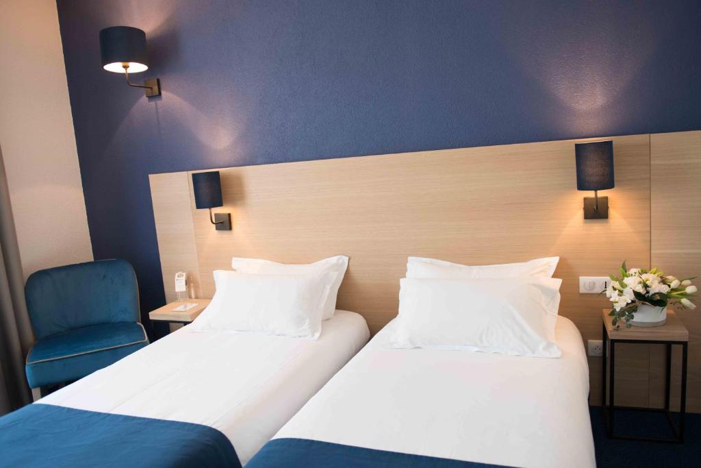 Postel nebo postele na pokoji v ubytování Best Western Hôtel Le Sud