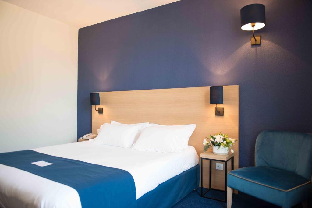 Postel nebo postele na pokoji v ubytování Best Western Hôtel Le Sud