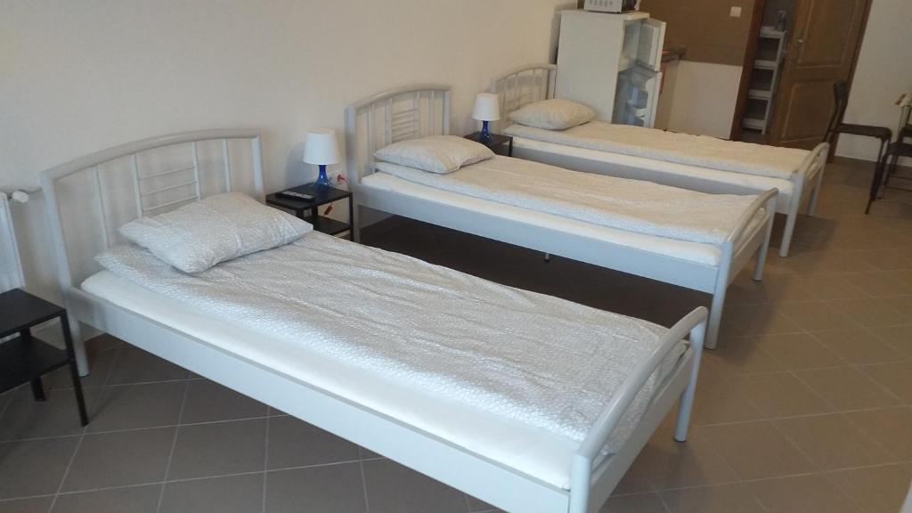 Postel nebo postele na pokoji v ubytování Kisdunapart 510