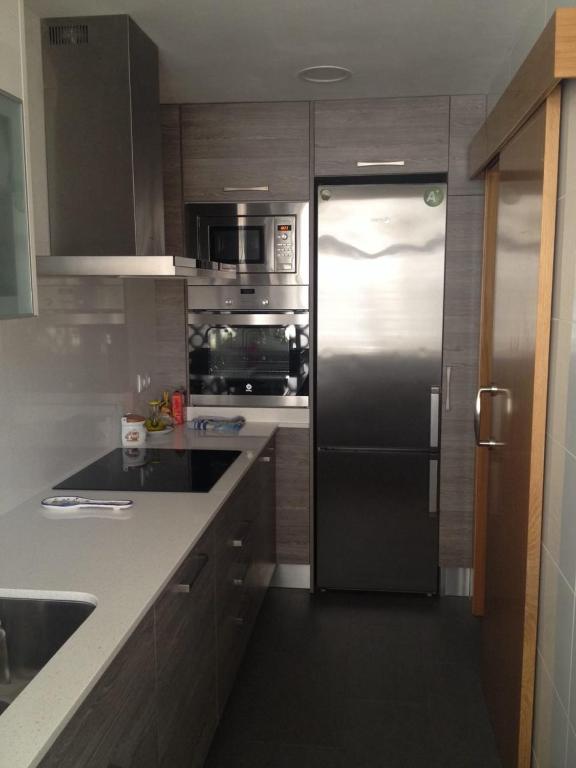 Kuchyňa alebo kuchynka v ubytovaní Apartamento Primera Linea de Mar, Cunit