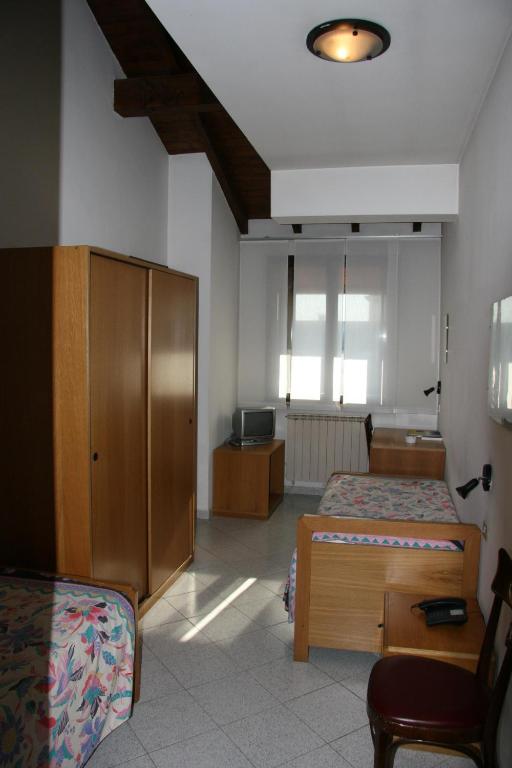 Postel nebo postele na pokoji v ubytování Albergo Sant'Anna