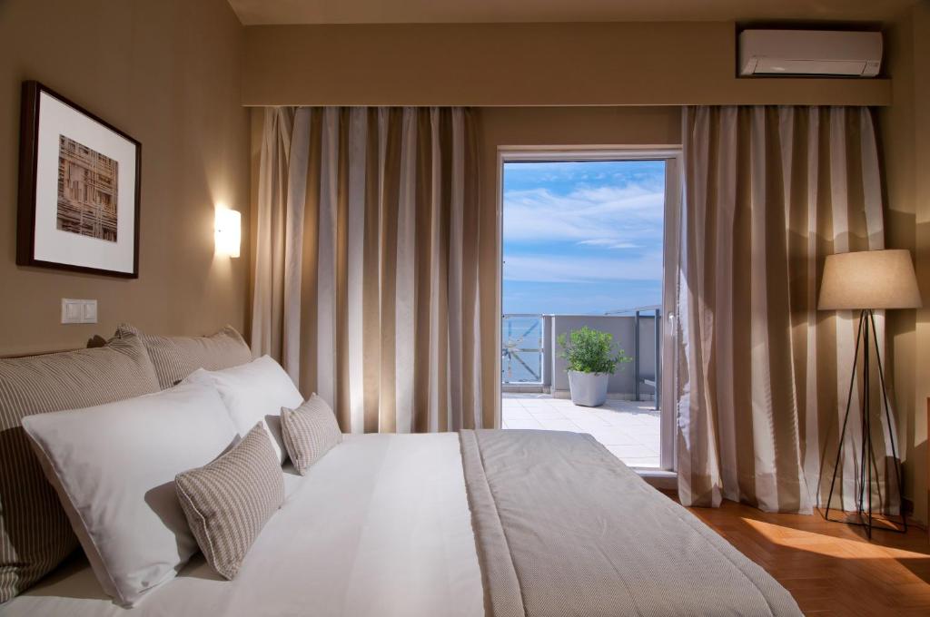 Postel nebo postele na pokoji v ubytování Hotel Delfini