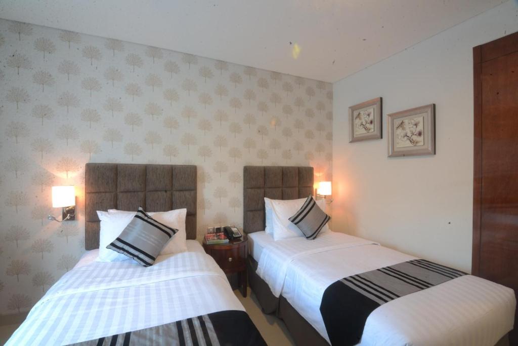 Letto o letti in una camera di Hotel Permata Bogor