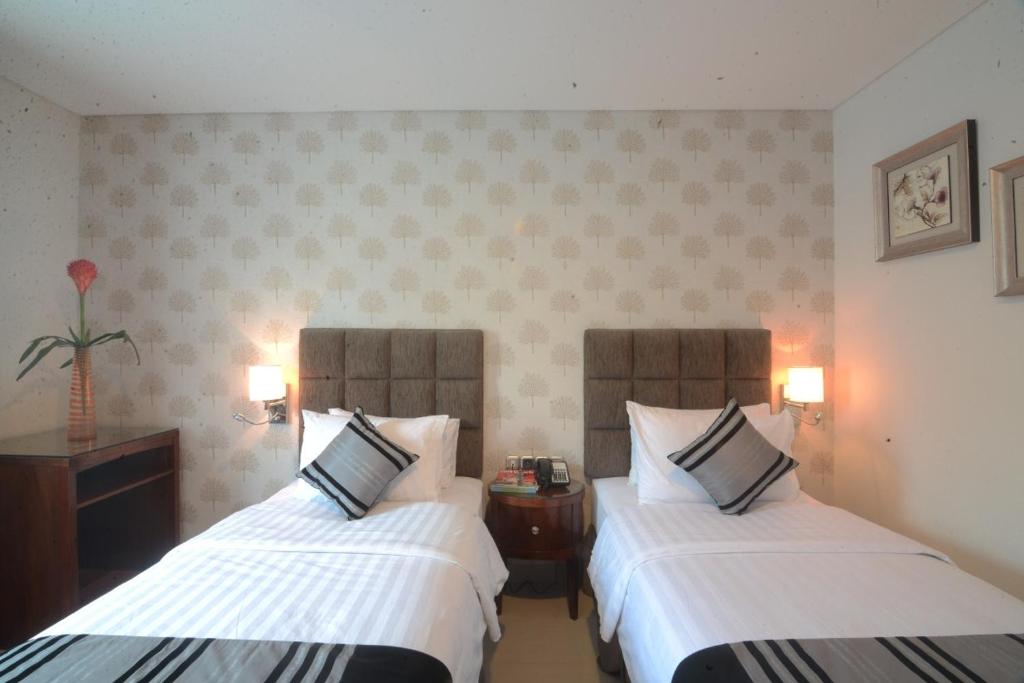 Letto o letti in una camera di Hotel Permata Bogor