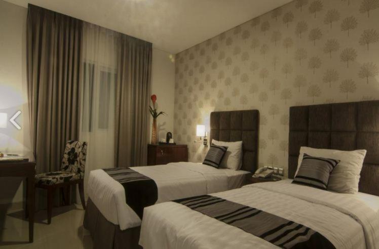 Letto o letti in una camera di Hotel Permata Bogor
