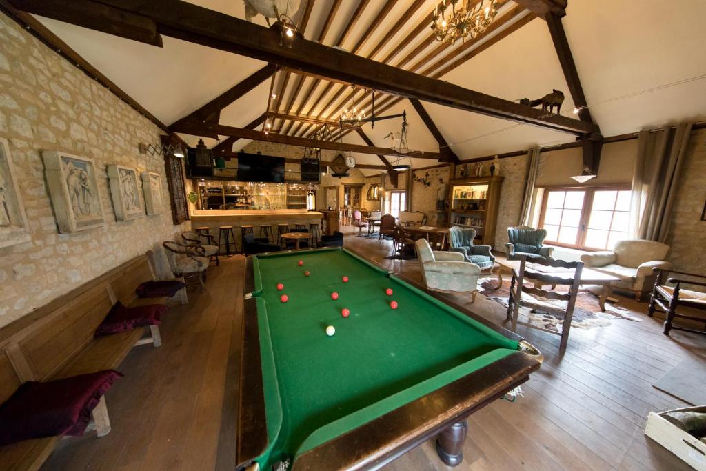 a large room with a pool table in it at Domaine Utah Beach - Le Grand Hard in Sainte-Marie-du-Mont