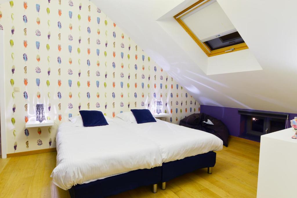 Postel nebo postele na pokoji v ubytování Durbuy Ô Restaurant Hotel