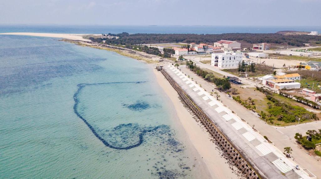 an aerial view of a beach and the ocean at Xiang Xie Min Su in Baisha