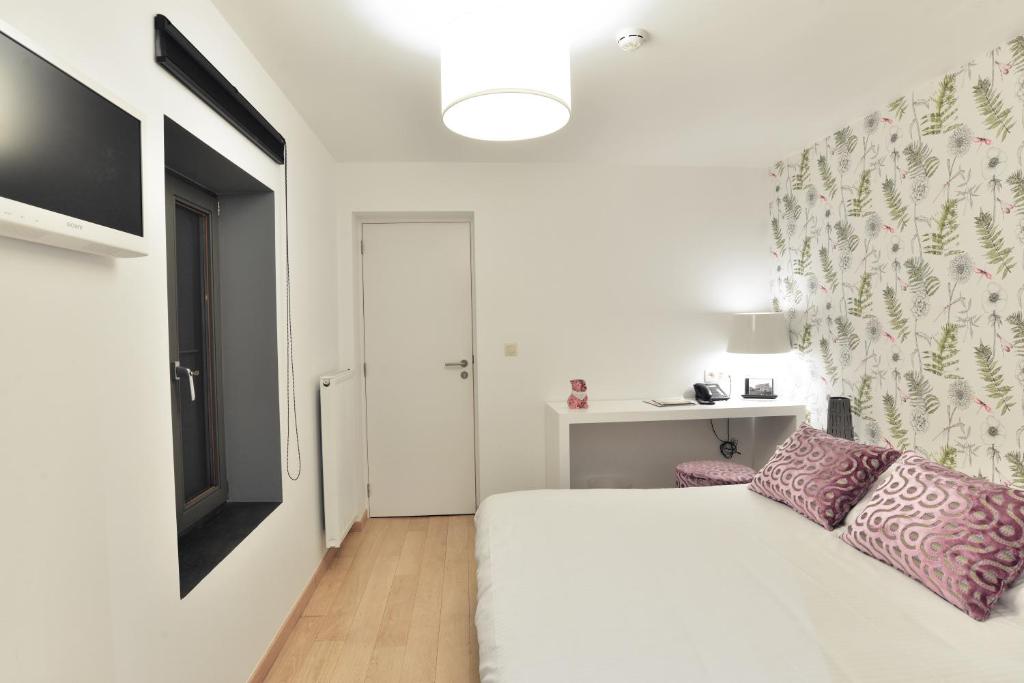 Postel nebo postele na pokoji v ubytování Durbuy Ô Restaurant Hotel
