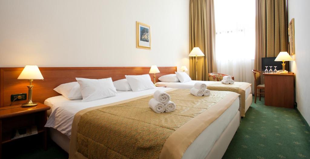Postel nebo postele na pokoji v ubytování Hotel Globo
