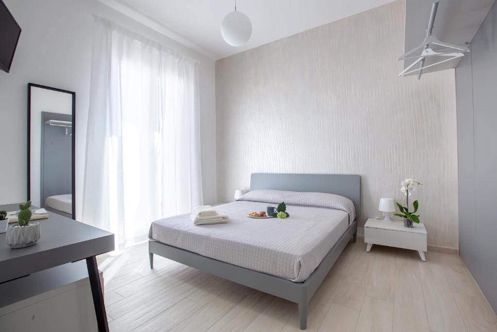 Postel nebo postele na pokoji v ubytování Aruci b&b