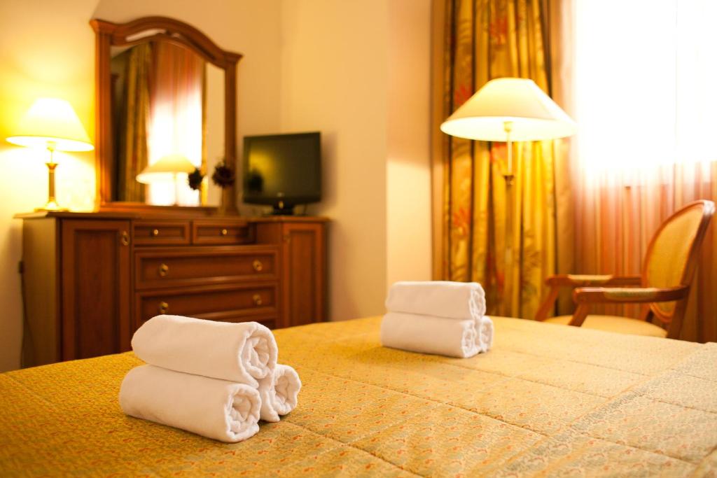 Postel nebo postele na pokoji v ubytování Hotel Globo