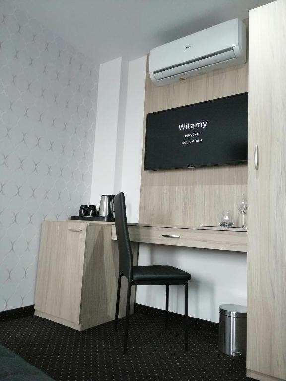 Televízia a/alebo spoločenská miestnosť v ubytovaní Willa Sandomierska
