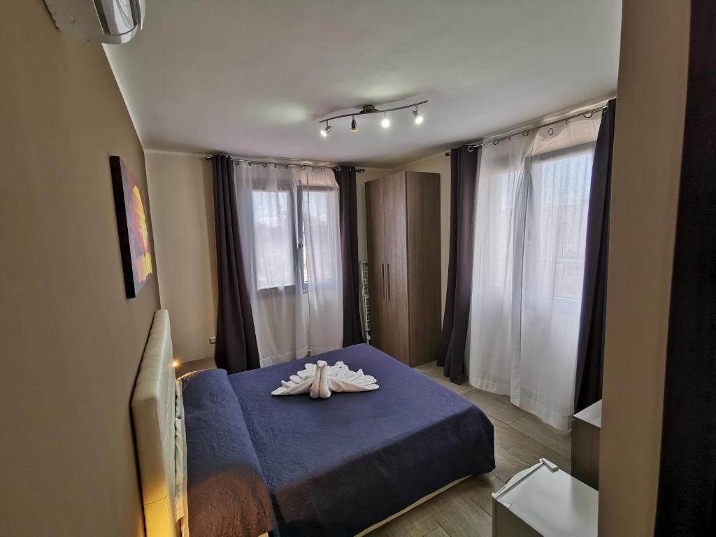 Кровать или кровати в номере Samanà B&B con Spiaggia Privata a Punta Prosciutto