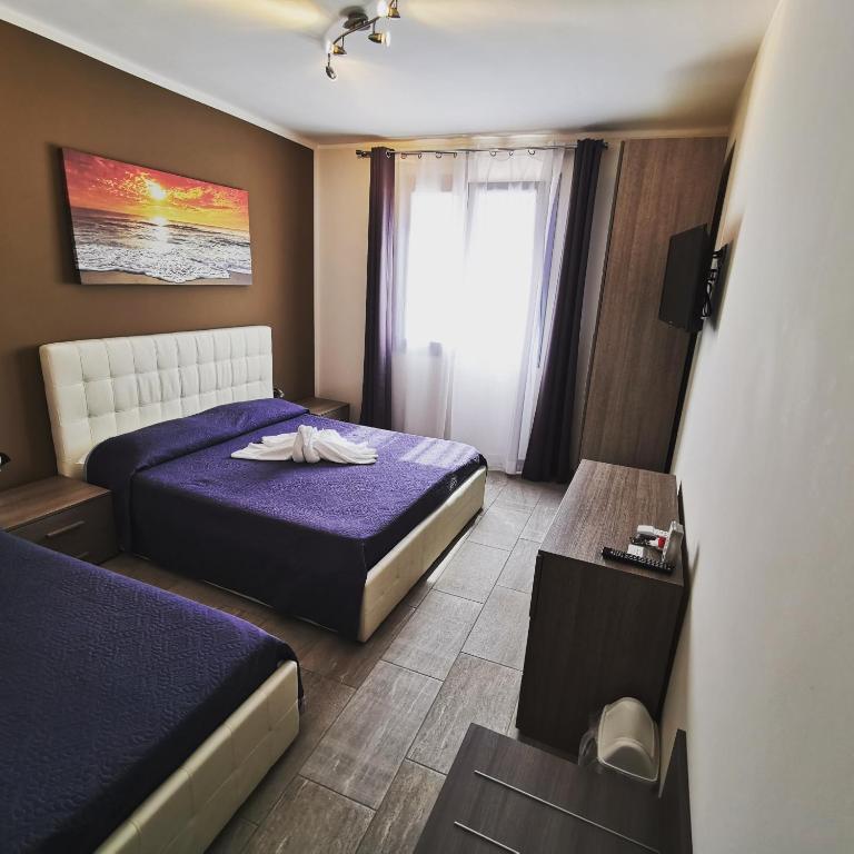 Кровать или кровати в номере Samanà B&B con Spiaggia Privata a Punta Prosciutto
