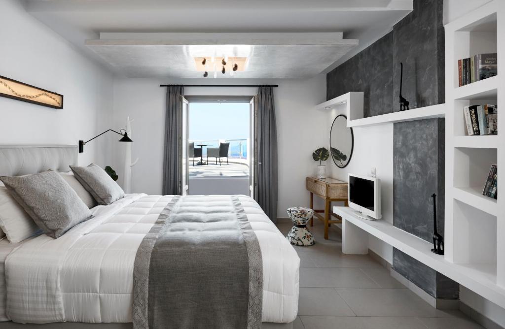 Postel nebo postele na pokoji v ubytování Petit Palace Suites
