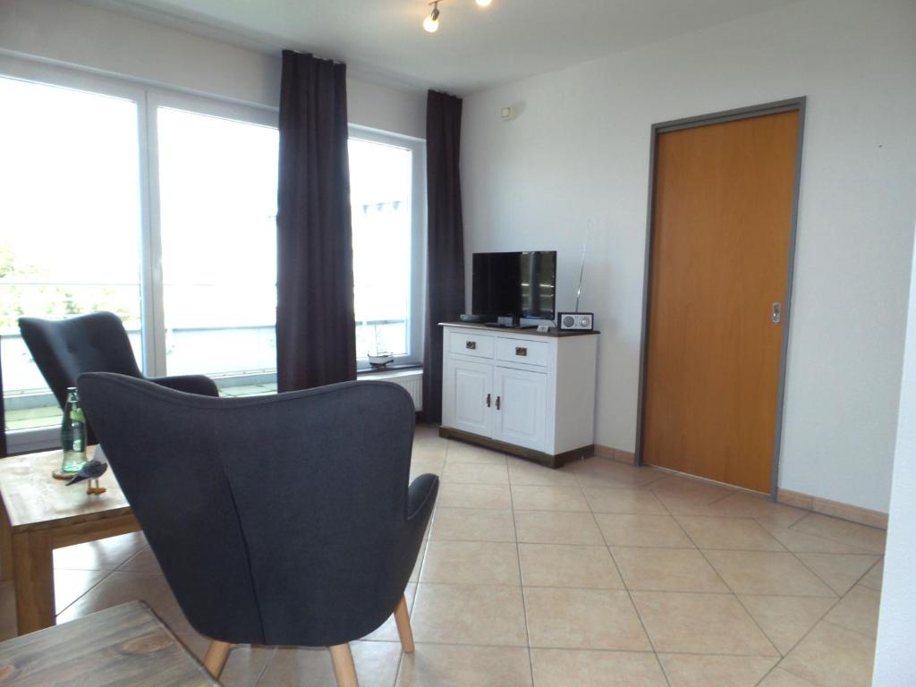 TV a/nebo společenská místnost v ubytování strandnahe FeWos mit Balkon, Residenz Bel Vital - Kategorie B