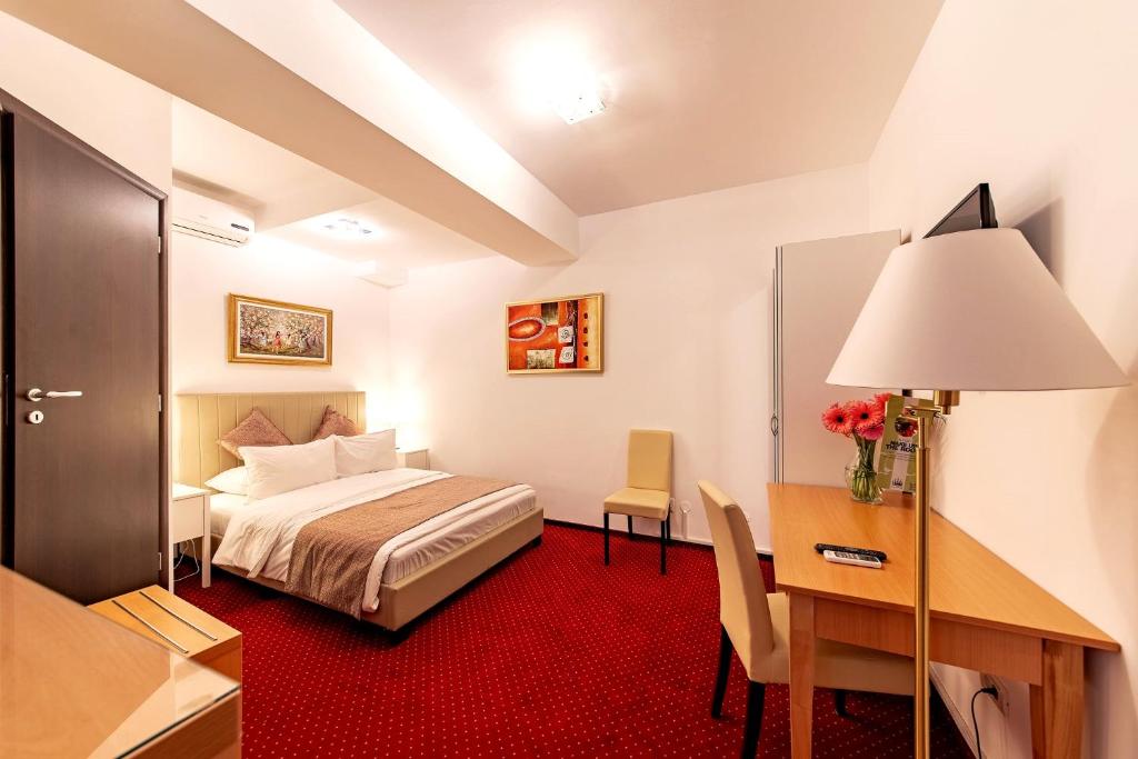 Postel nebo postele na pokoji v ubytování Bucur Accommodation