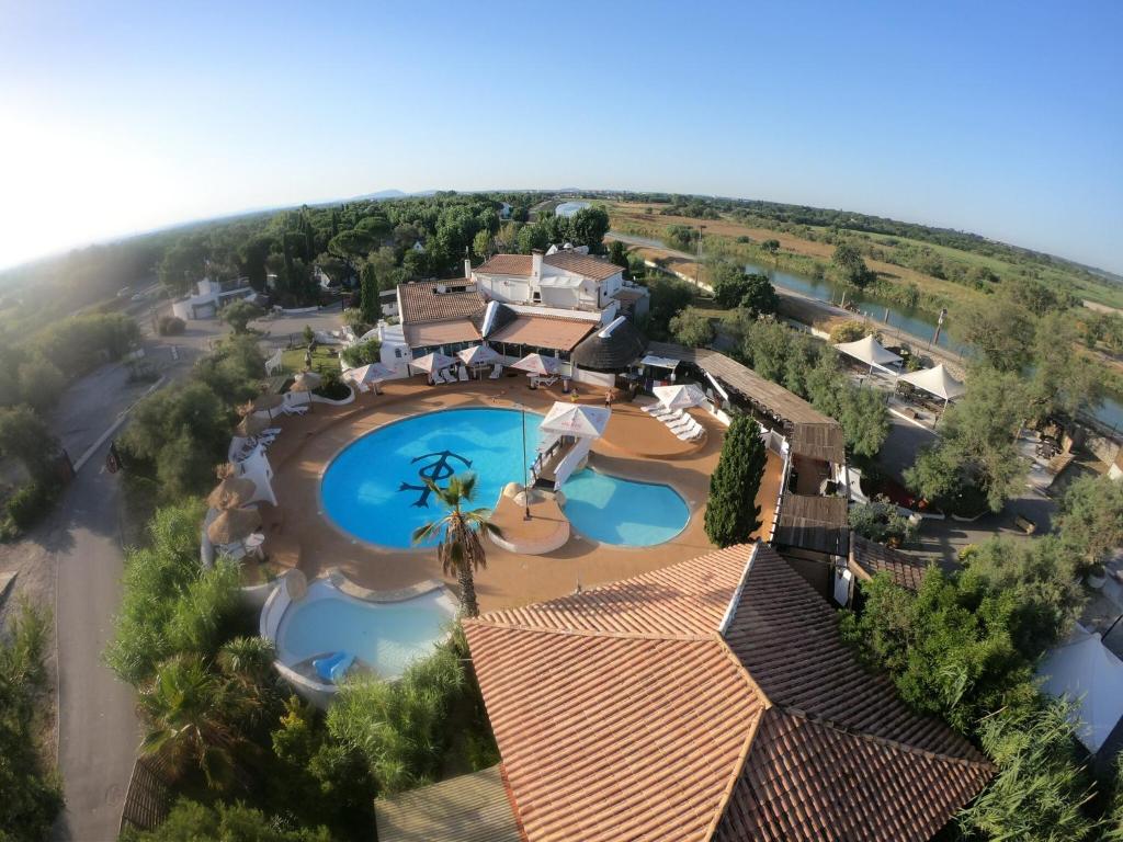 an aerial view of a resort with two pools at Camping le Camarguais in Lattes