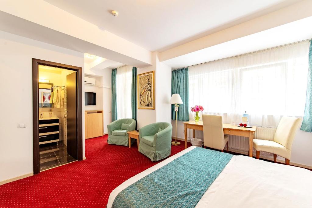 Postel nebo postele na pokoji v ubytování Bucur Accommodation