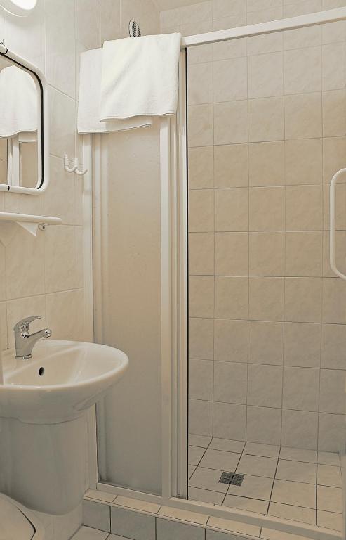 Koupelna v ubytování Hotel Adamantino