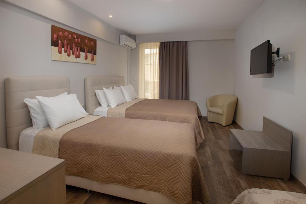 Łóżko lub łóżka w pokoju w obiekcie Irini Hotel