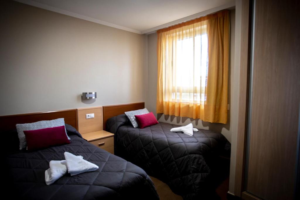 Postel nebo postele na pokoji v ubytování Hostal Campestre