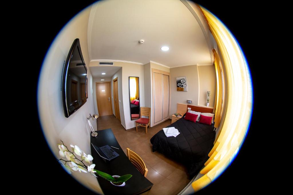 TV a/nebo společenská místnost v ubytování Hostal Campestre
