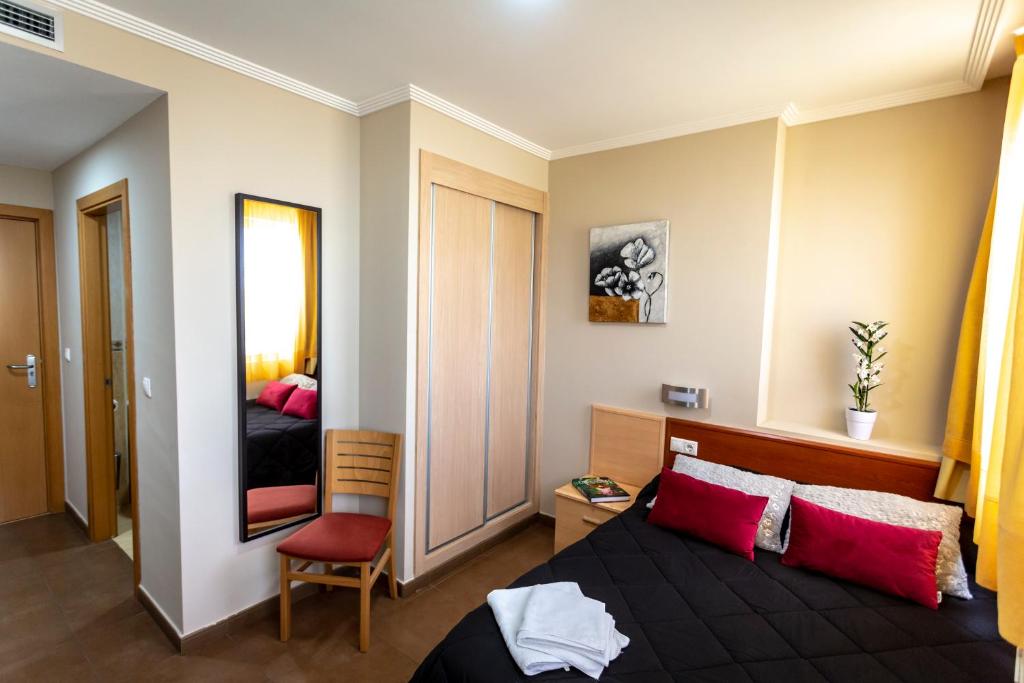 Postel nebo postele na pokoji v ubytování Hostal Campestre