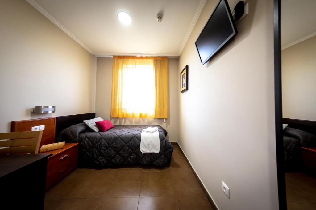 TV a/nebo společenská místnost v ubytování Hostal Campestre
