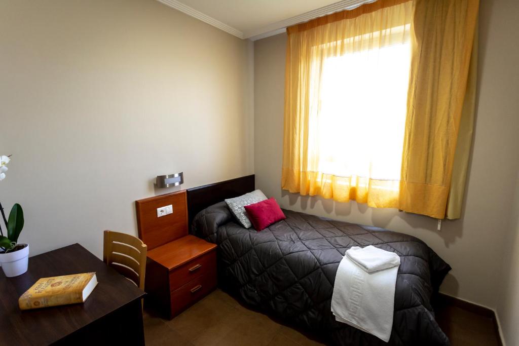 Postel nebo postele na pokoji v ubytování Hostal Campestre