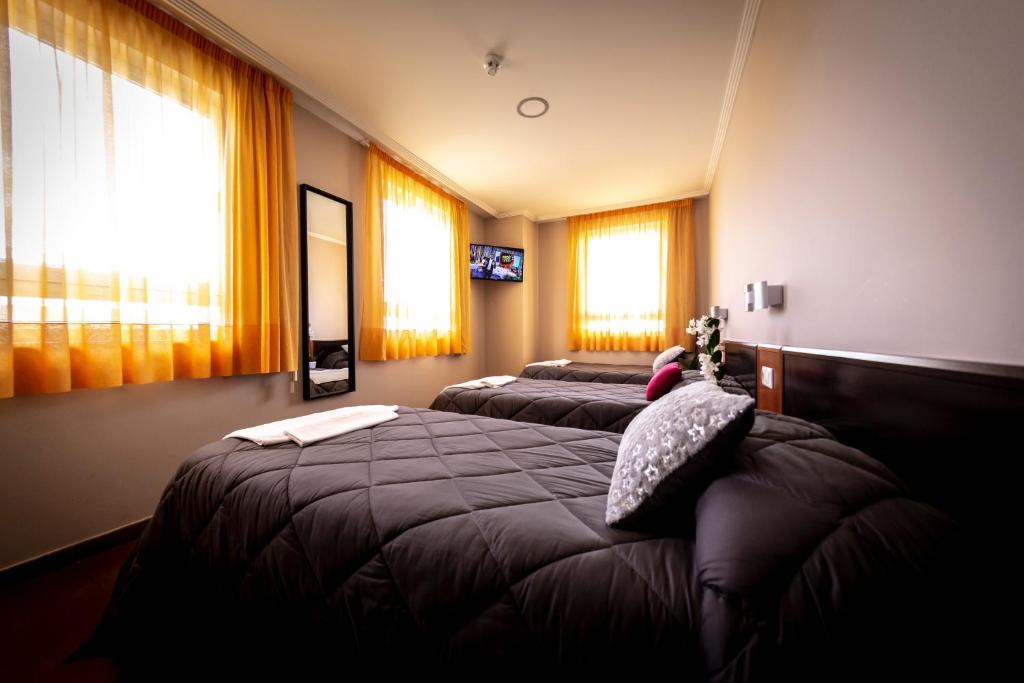 Postel nebo postele na pokoji v ubytování Hostal Campestre