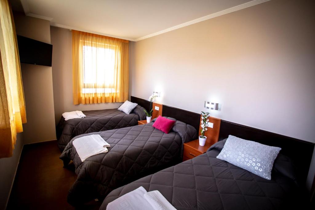 Postel nebo postele na pokoji v ubytování Hostal Campestre