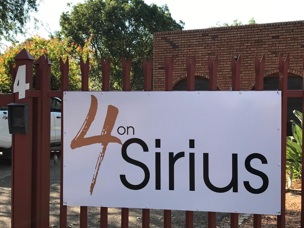 a sign on a fence that says on shifts at 4 on Sirius in Polokwane