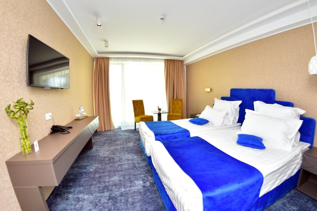 Postel nebo postele na pokoji v ubytování Stavros Hotel
