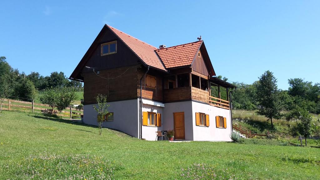 a small house on a hill in a field at Thermal SPA Marija in Topusko