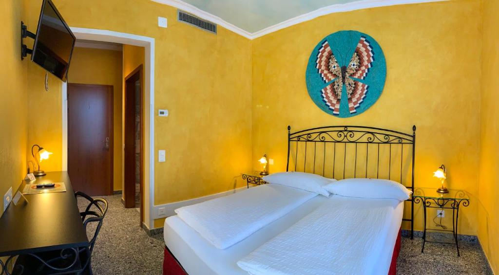 Postel nebo postele na pokoji v ubytování Hotel&Hostel Montarina