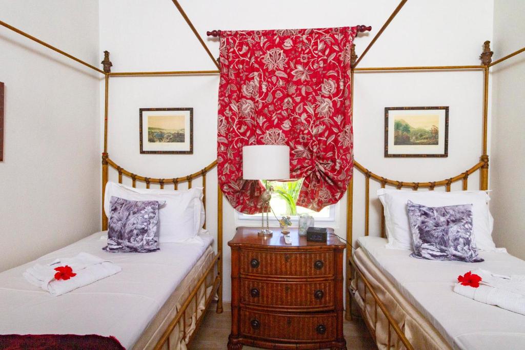 Postel nebo postele na pokoji v ubytování Bequia Beach Hotel - Luxury Boutique Resort