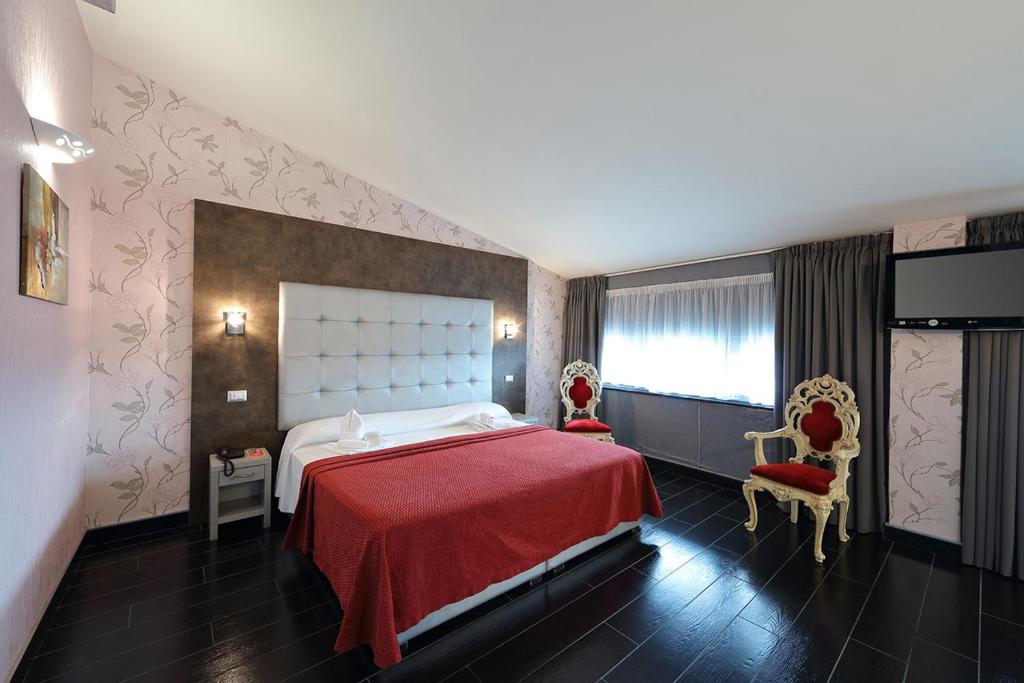 Postel nebo postele na pokoji v ubytování Hotel Relax Roma Nord