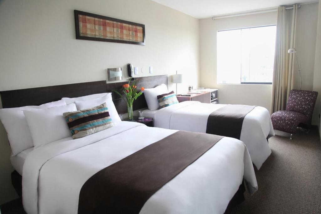 Postel nebo postele na pokoji v ubytování Hotel Rivera Inn